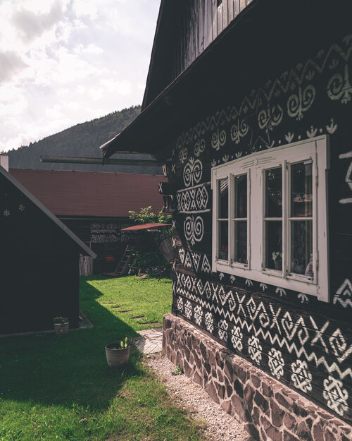 Traditional Cicmany house covered in white patterns